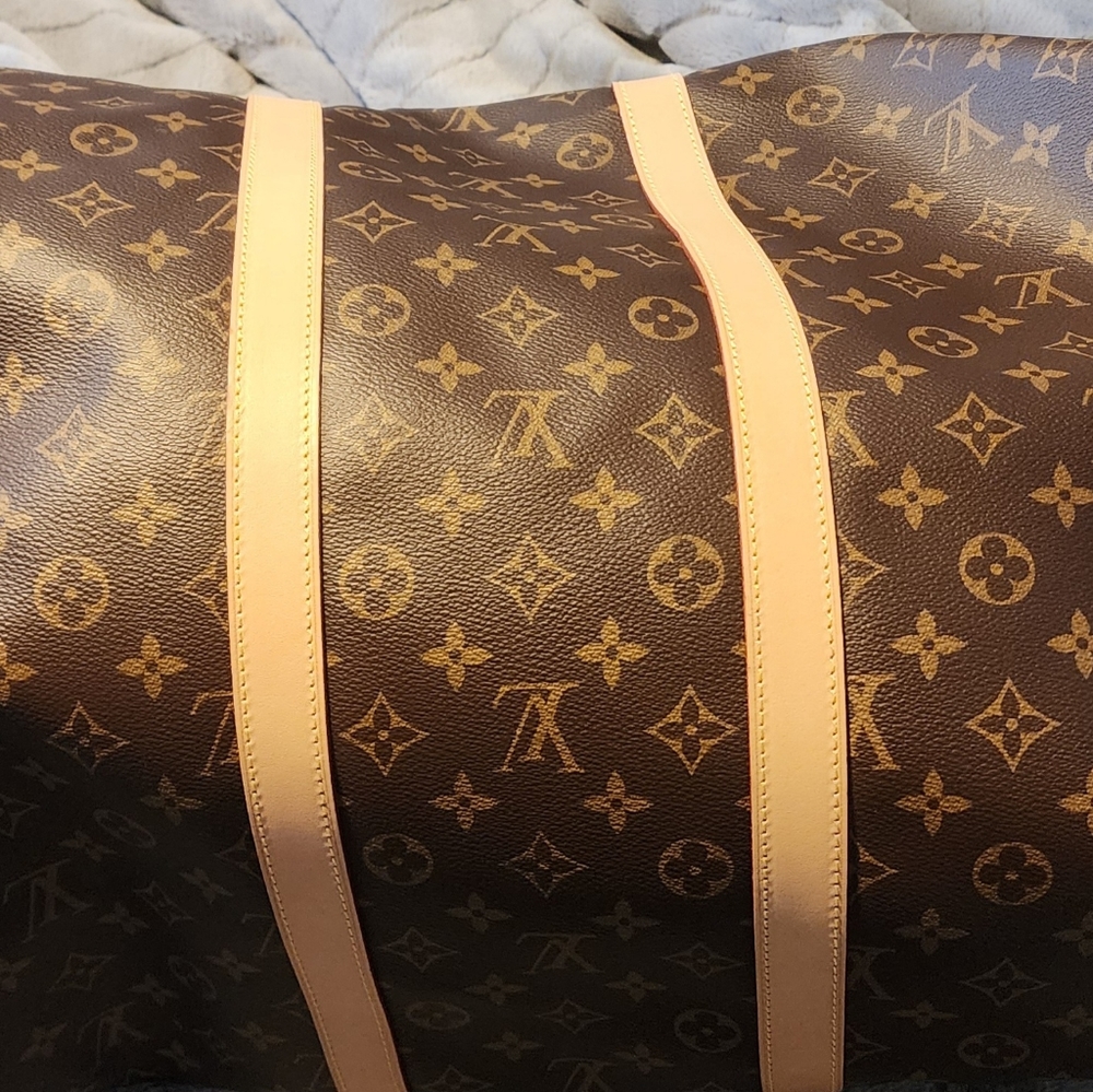 Louis vuitton duffle bag.  Bag tag monogrammed included dust cover.  Clean bag
